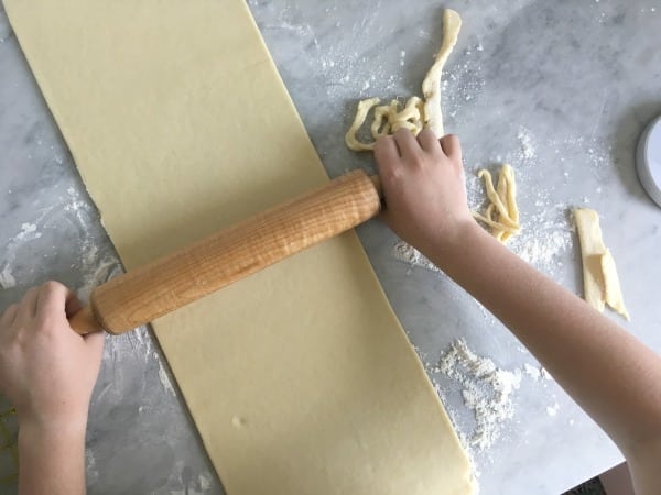 rolling dough for croissants