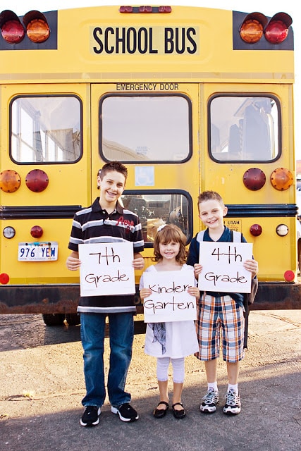 kids with school bus as back to school picture prop