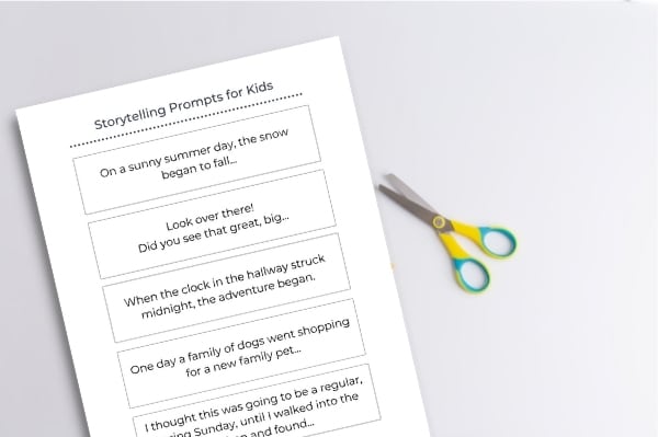 storytelling prompts for kids printed out on table with scissors