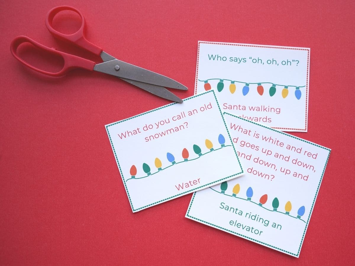 christmas jokes printed on paper with scissors