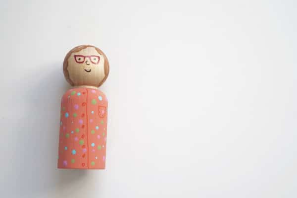 peg doll with face on