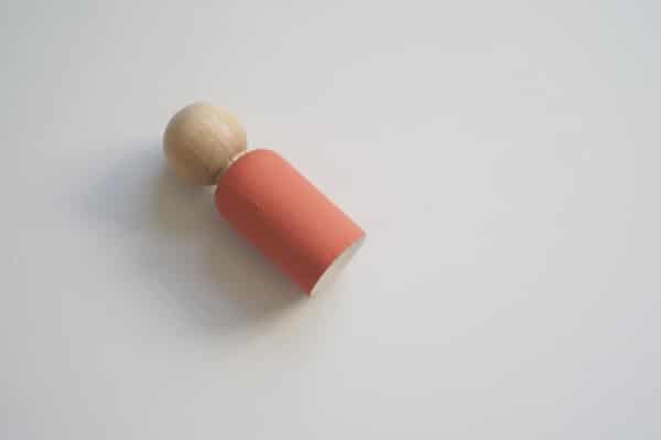 wooden peg doll with painted top