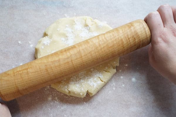 jam sandwich cookie dough with rolling pin