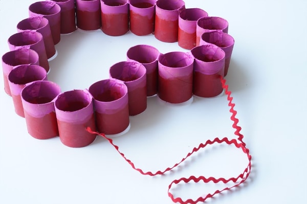 ribbon in toilet paper roll Valentine's Day heart to hang on door