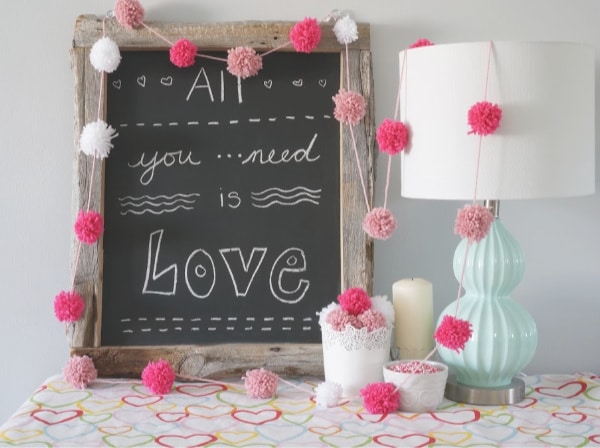 yarn wrapped around pom pom maker