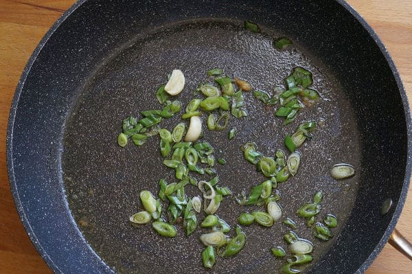 spring onions and garlic in pan