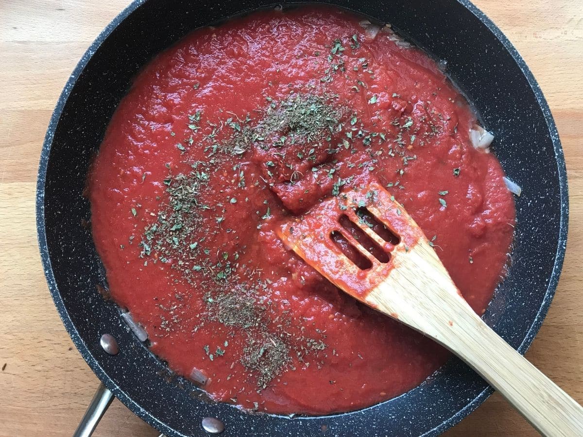 vegetarian lasagna roll tomato sauce in pan