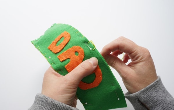 blanket stitch on edge of coffee cozy