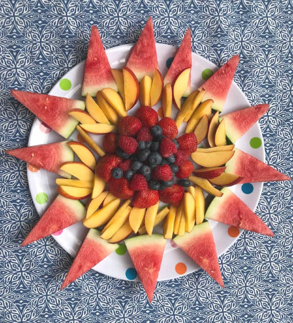 fruit platter with berries in middle of the fruit tray