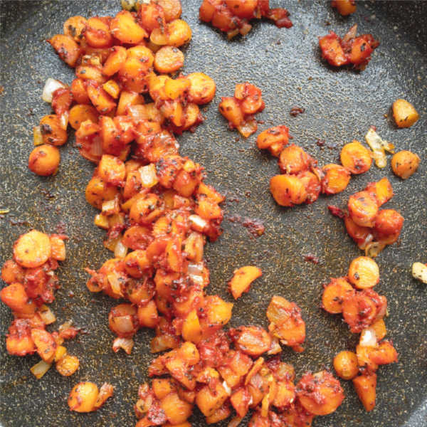 carrots an onions cooking in pan