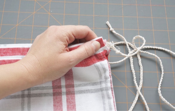 safety pin on the end of the string going into drawstring channel