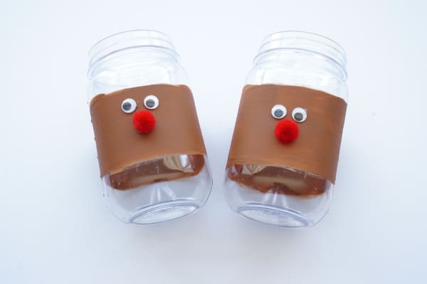 stripe of brown paint with reindeer face on jar
