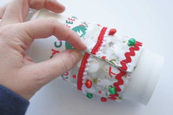 coffee cup cozy around the coffee cup and pinned