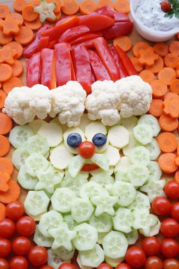 santa veggie tray with carrot background and cherry tomato shirt