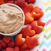 chocolate cream cheese fruit dip in bowl with berries