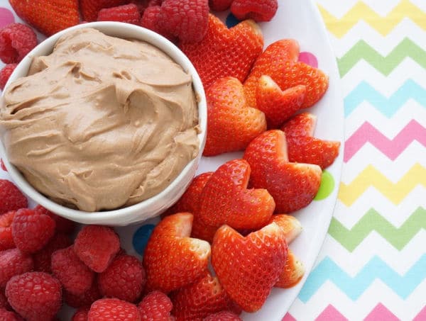 chocolate cream cheese fruit dip in bowl with berries