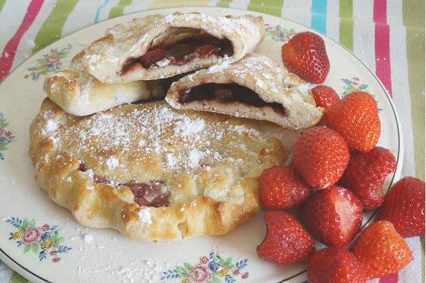 nutella and strawberry calzones baked and cut in half