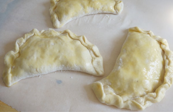 nectarine calzones on parchment paper