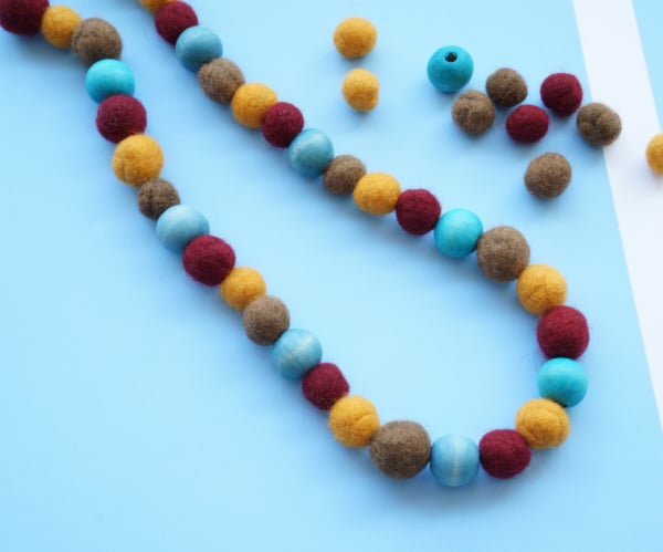 felt balls in pattern for necklace with wooden balls