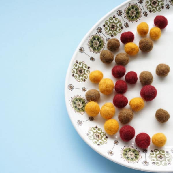 felt balls for necklace on plate