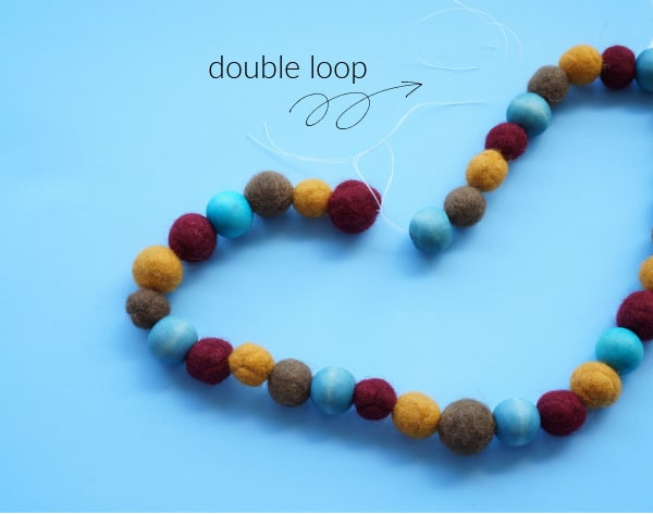 surgeon's knot in felted ball necklace