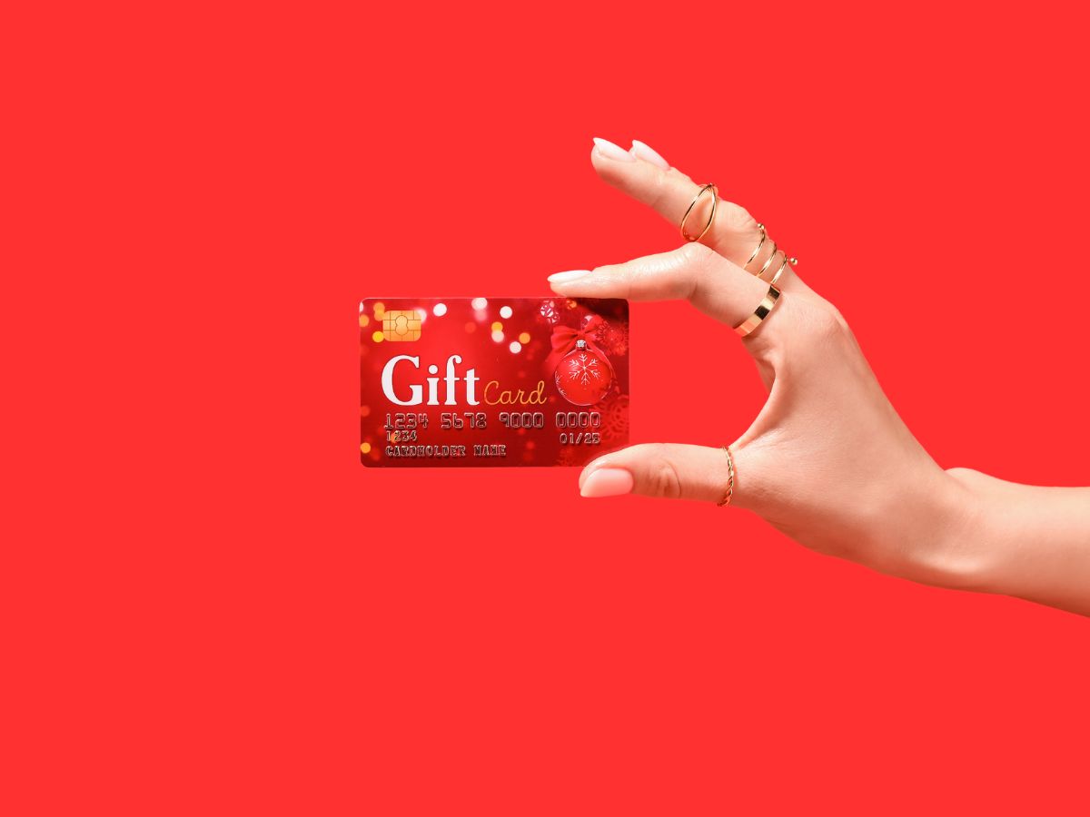 christmas gift card in woman's hand