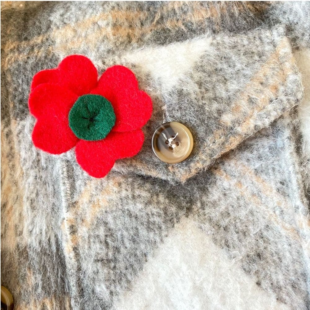 poppy pin on coat