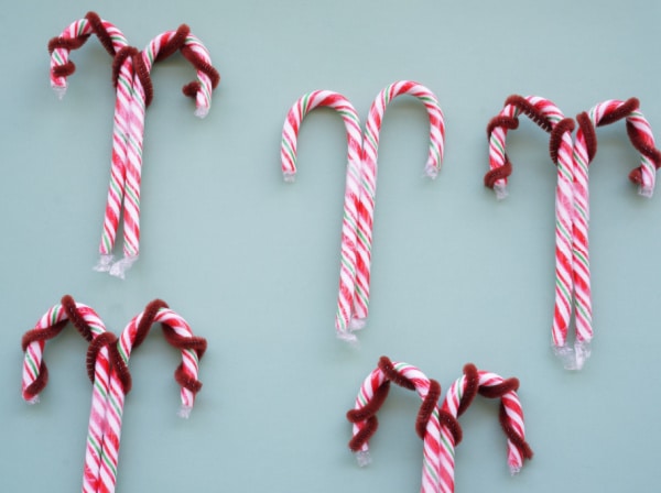 reindeer candy canes with pipe cleaner antlers and taped together