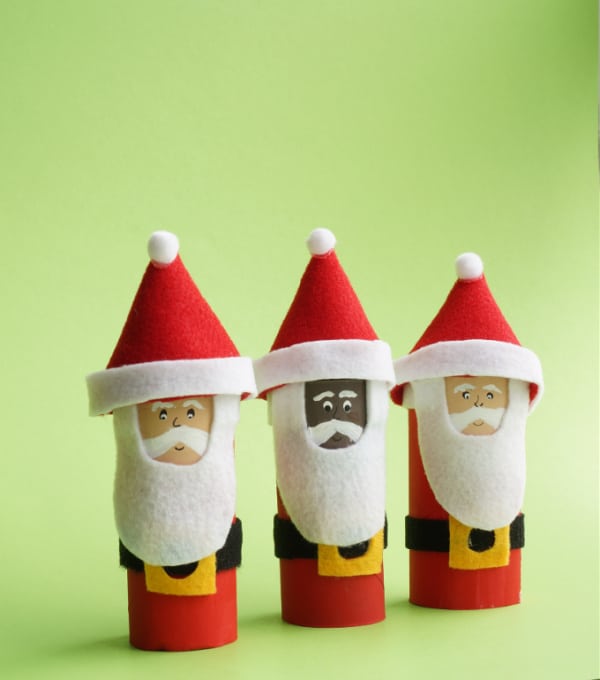 3 toilet paper roll santas all lined up one Black santa and two caucasian santas