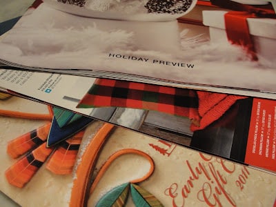 brightly colored pages from magazines in a pile on a table