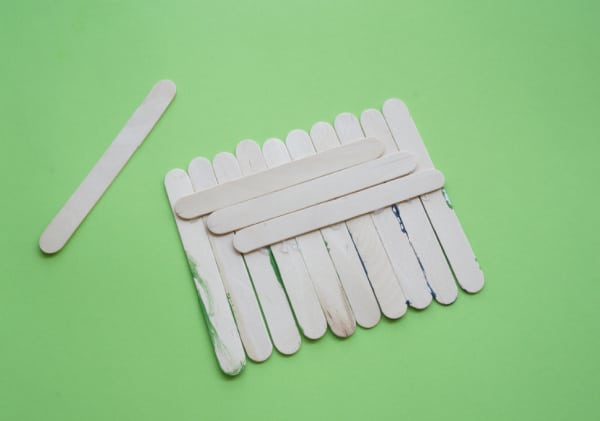 craft sticks glued together side by side