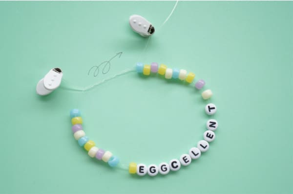 easter bead bracelet with surgeon's knot tied in string