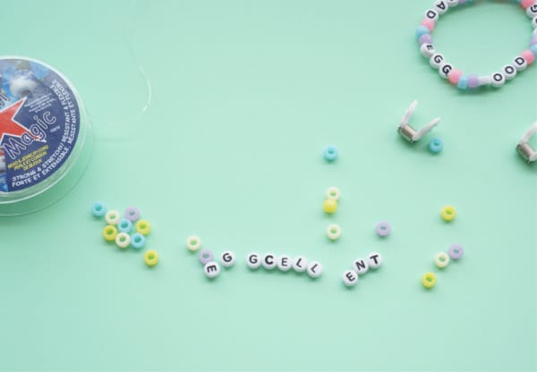 making an easter friendship bracelet supplies on table