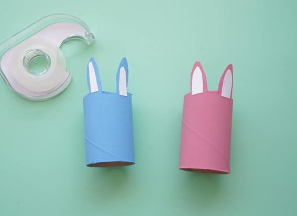 toilet paper bunnies with white inner ears and spool of tape