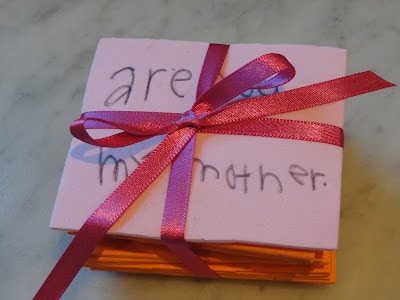 pile of animal memory game cards wrapped in pink ribbon