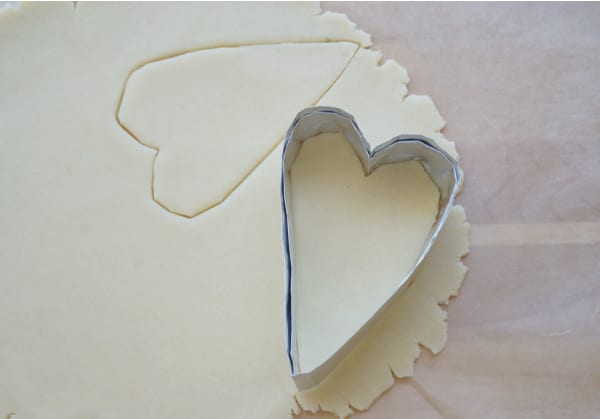 diy heart cookie cutter pressed into cookie dough