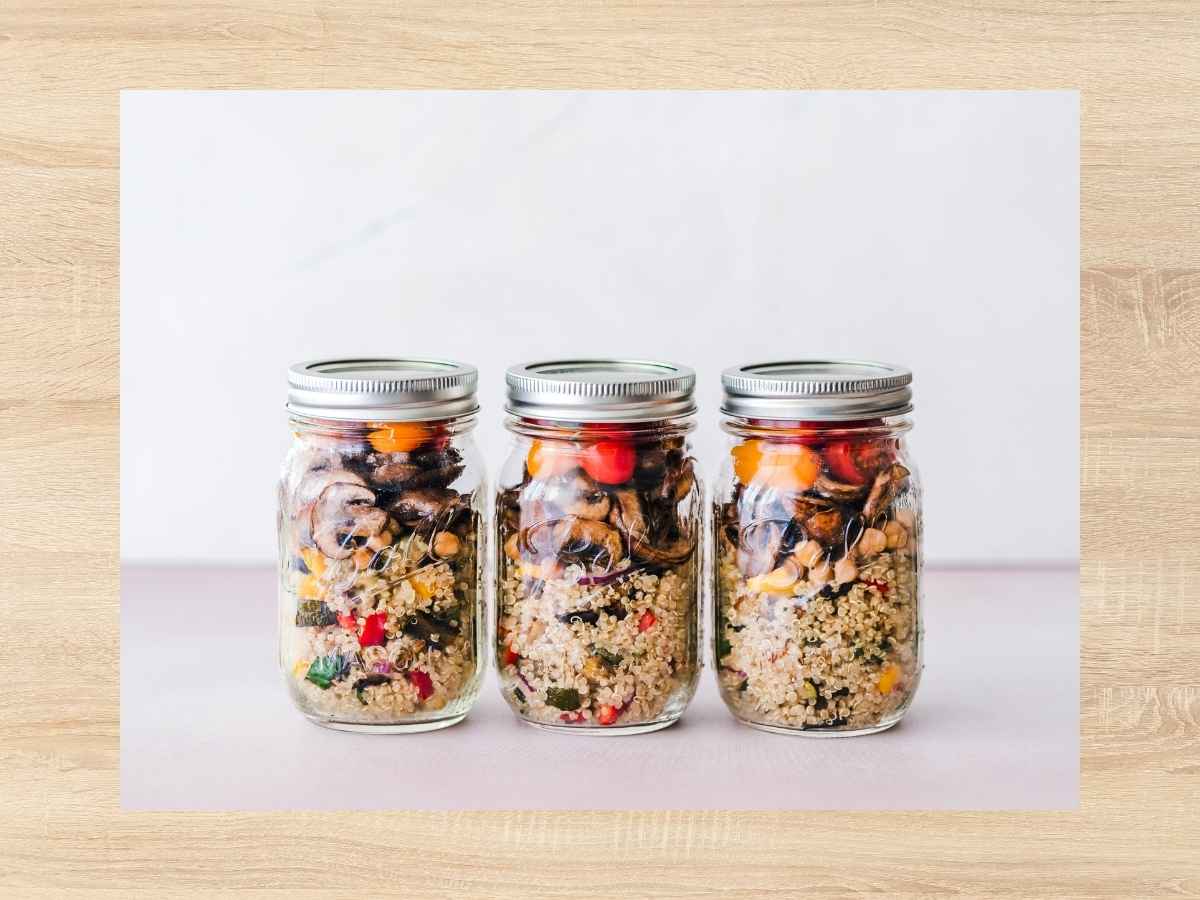 row of mason jars filled with oats and fruit