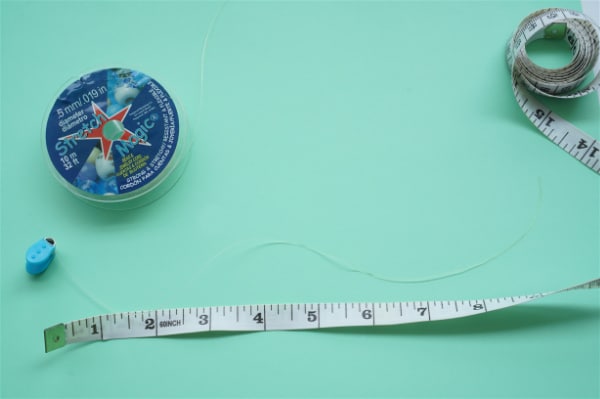 bead bug with stretch thread and tape measurer