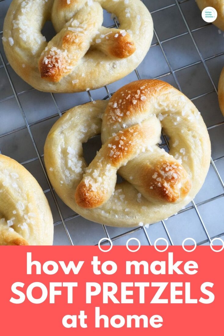 title How to Make Soft Pretzels at Home with close up image of soft pretzels on cooling rack