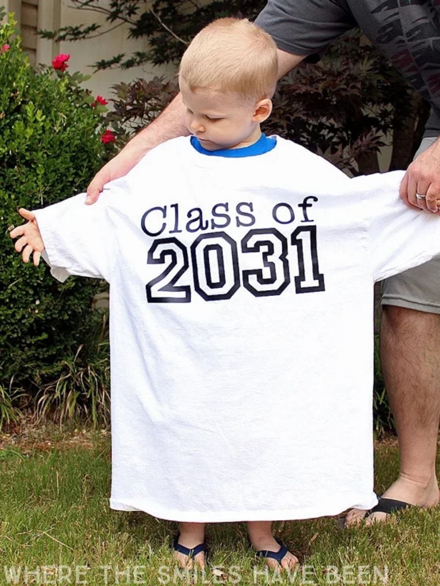 child wearing big first day of school t-shirt that they can wear each year
