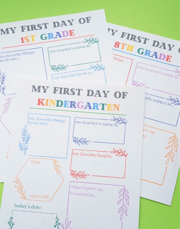 pile of first day of school printable signs