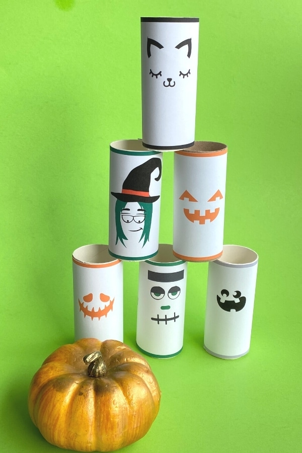 halloween pumpkin bowling game with toilet paper pins all stacked up and little pumpkin
