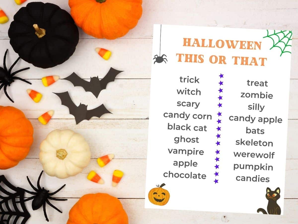 halloween this or that printable on table with pumpkins and candy corn bats and spiders