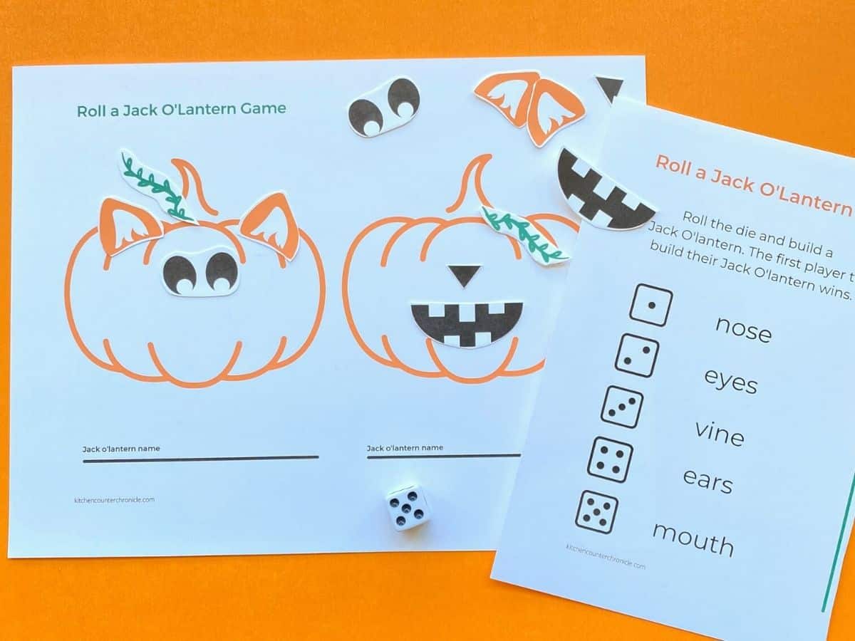 roll a jack olantern game being played with pieces and die