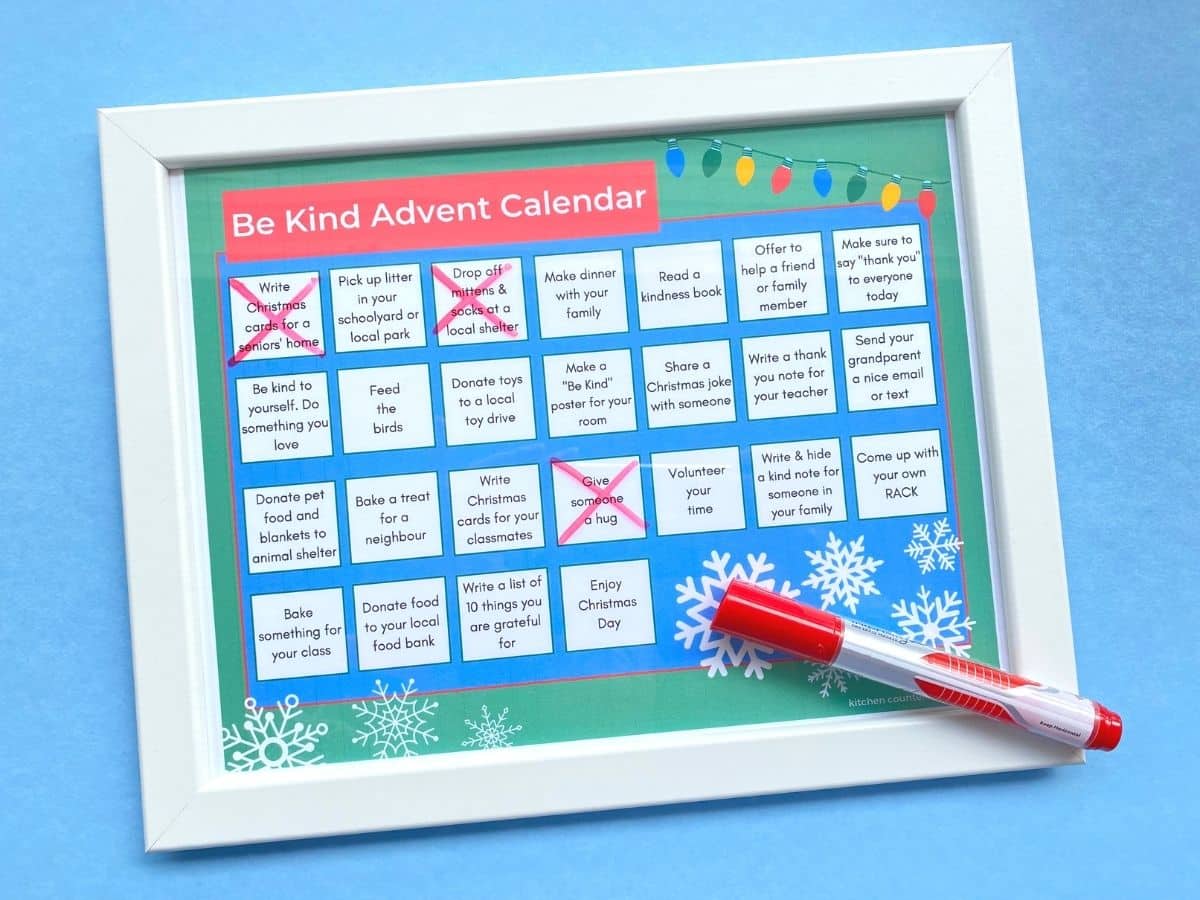 be kind advent calendar in frame with white board marker