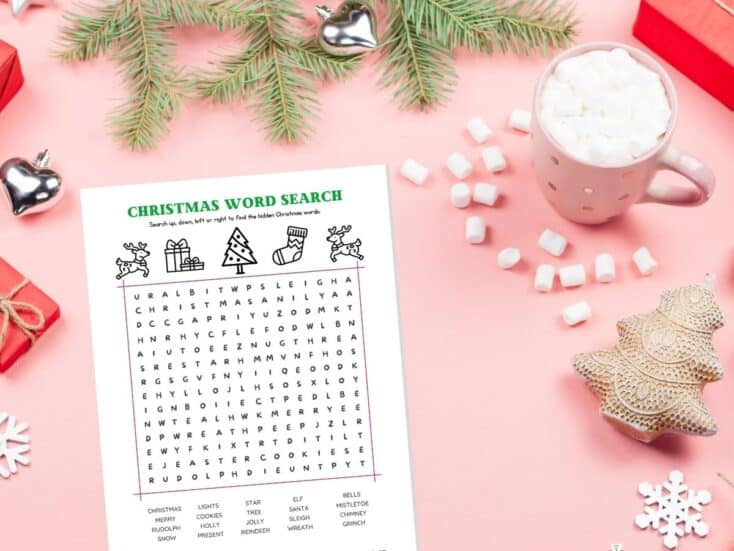christmas word search game on table with cup of hot chocolate