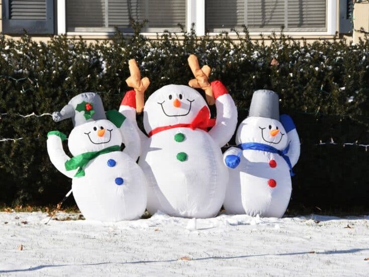 house with snowmen inflatables