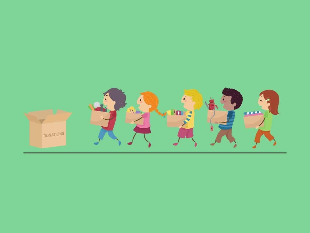 people holding boxes filled with items to donate