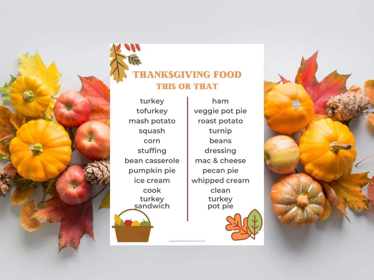 thanksgiving this or that printed on paper on table with gourds and leaves around it