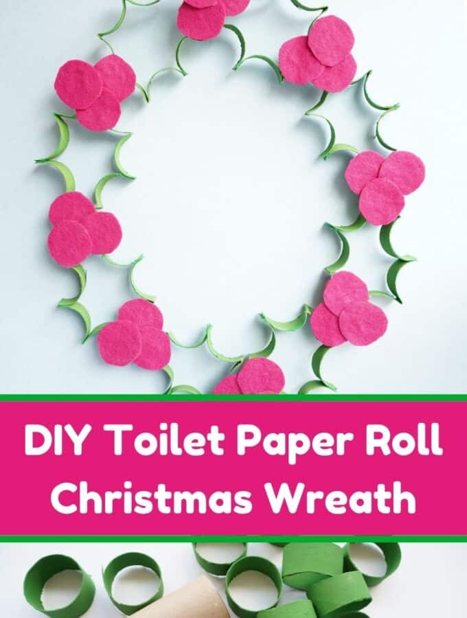 toilet paper roll christmas wreath hanging on wall with title and unpainted toilet paper rolls